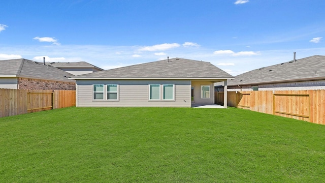 21750 Southern Valley Ln, New Caney, TX 77357 - rear view of house featuring a shingled roof and a patio area