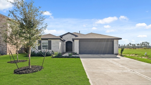 ranch-style home with a garage and a front yard