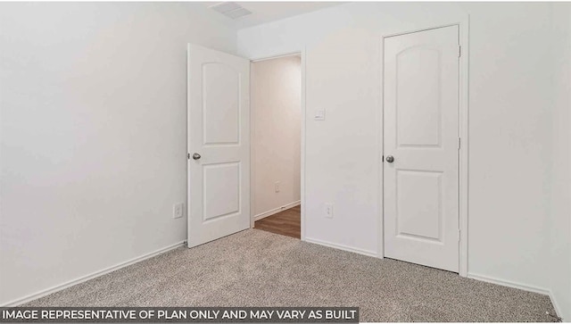 unfurnished bedroom with carpet flooring