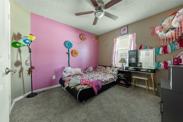 carpeted bedroom featuring a textured ceiling and ceiling fan