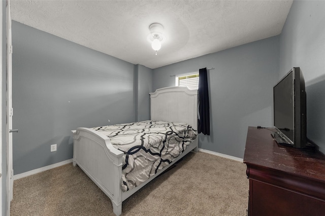 carpeted bedroom with a textured ceiling