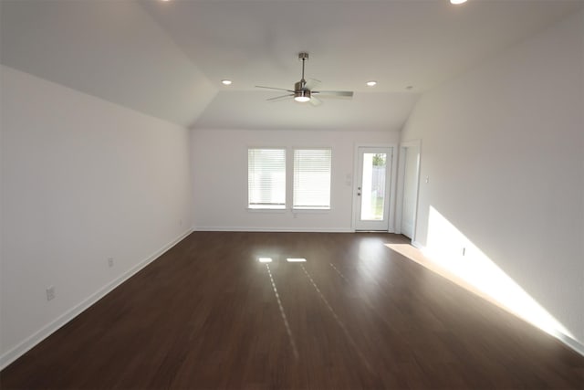 empty room with dark hardwood / wood-style floors, ceiling fan, and lofted ceiling