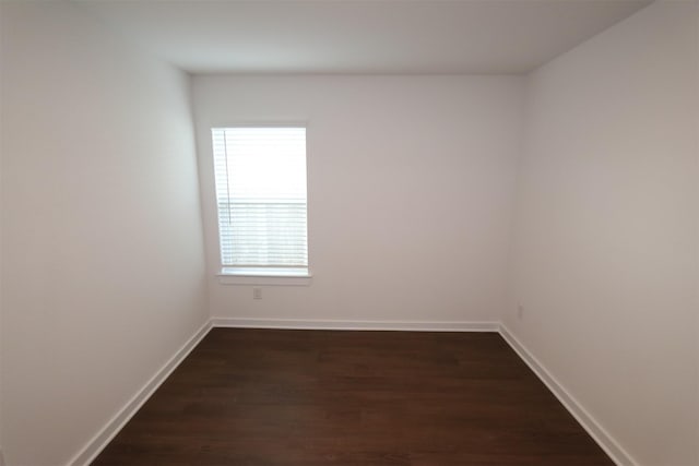 unfurnished room featuring dark hardwood / wood-style floors