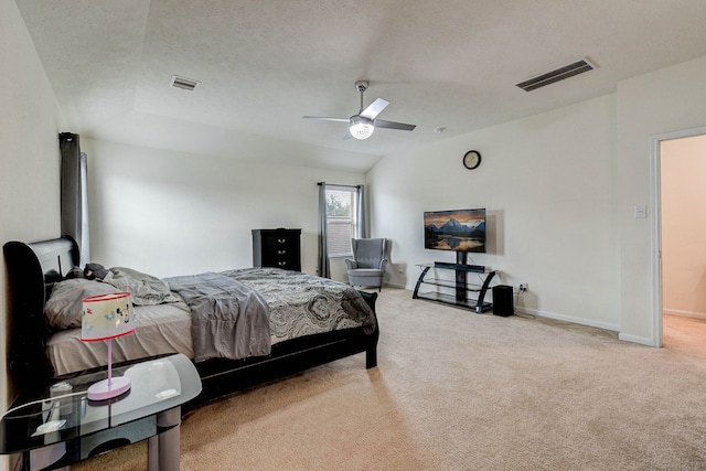 carpeted bedroom featuring ceiling fan, a textured ceiling, and lofted ceiling