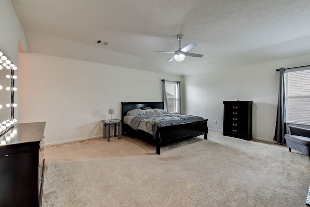 bedroom featuring ceiling fan and light colored carpet