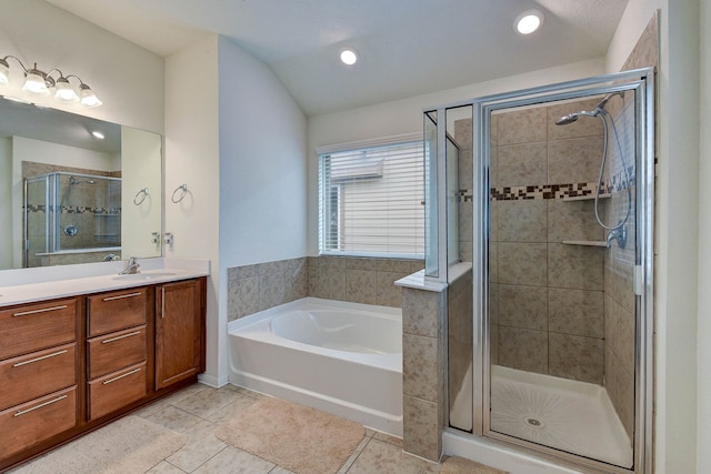 bathroom with lofted ceiling, vanity, separate shower and tub, and tile patterned floors