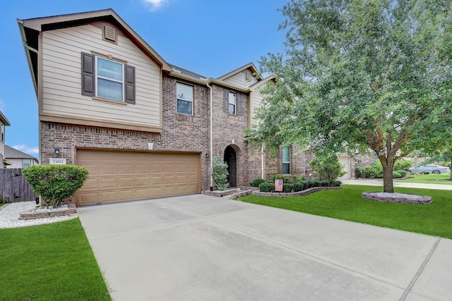 view of front of property featuring a garage and a front lawn