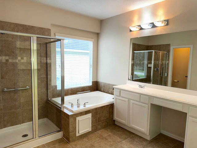 bathroom with vanity, tile patterned floors, and shower with separate bathtub