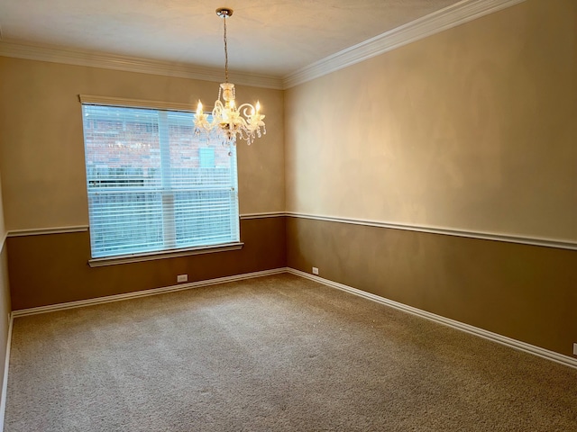 unfurnished room with carpet floors, an inviting chandelier, and ornamental molding