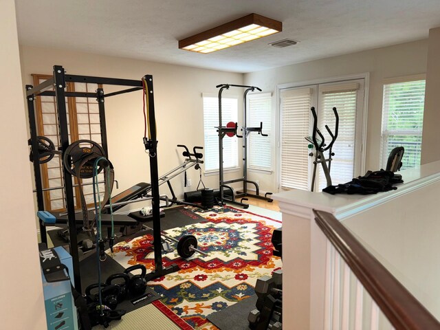 workout area with wood-type flooring