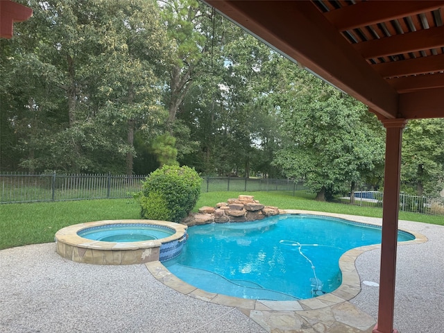 view of swimming pool with an in ground hot tub and a lawn