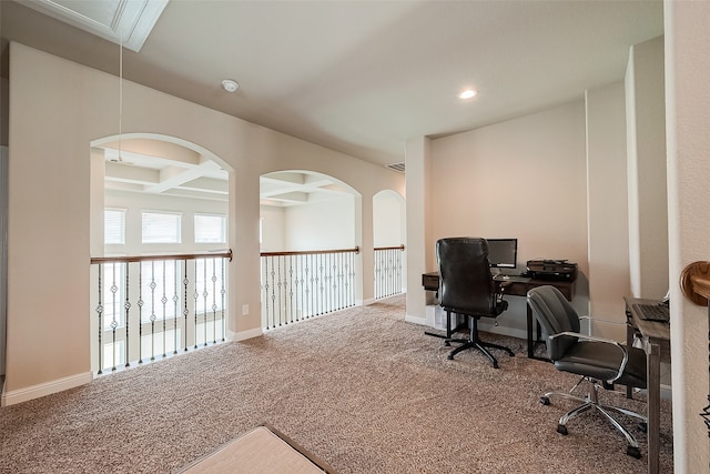 carpeted office space with coffered ceiling and beam ceiling