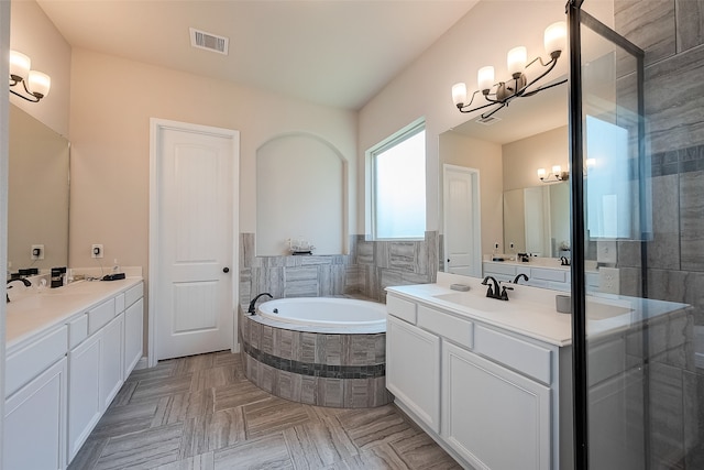 bathroom featuring vanity and plus walk in shower