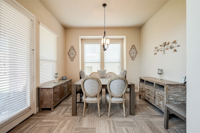 dining room with a notable chandelier