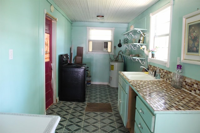 bathroom with backsplash, washer / clothes dryer, sink, water heater, and cooling unit