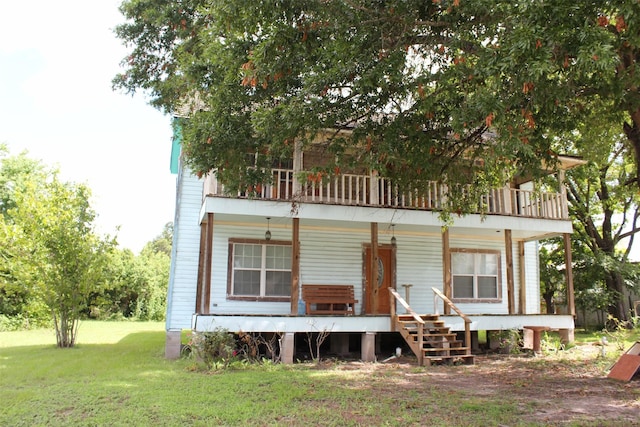 rear view of house with a yard