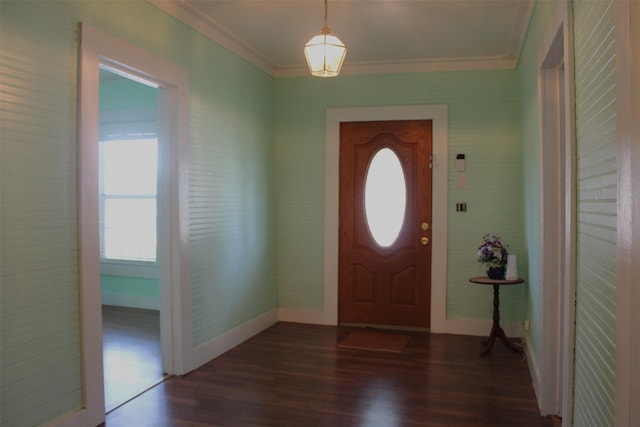 entryway with dark hardwood / wood-style flooring and ornamental molding