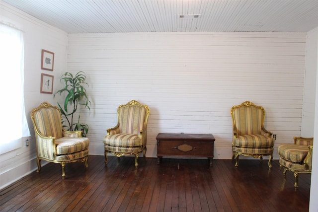 sitting room with dark wood-type flooring