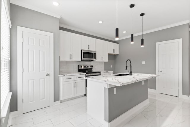 kitchen featuring sink, white cabinetry, a center island with sink, pendant lighting, and stainless steel appliances