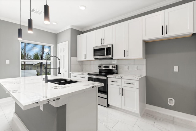 kitchen featuring white cabinetry, appliances with stainless steel finishes, a kitchen island with sink, and hanging light fixtures