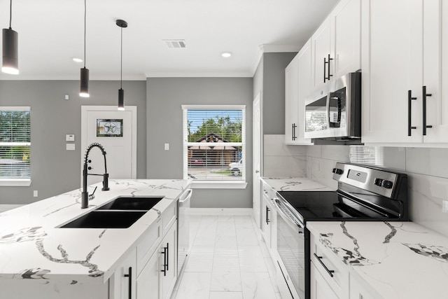 kitchen with pendant lighting, white cabinetry, stainless steel appliances, and sink