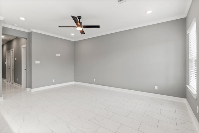 empty room with ceiling fan, ornamental molding, and a wealth of natural light