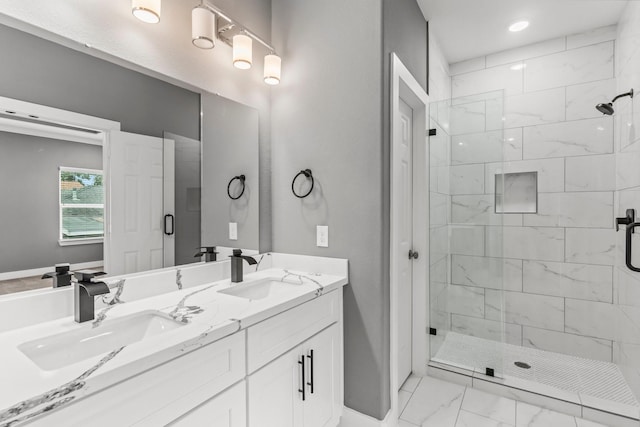 bathroom featuring vanity and a shower with shower door