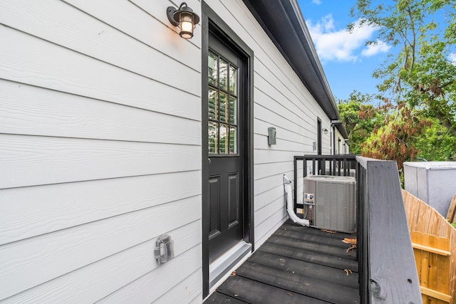 doorway to property featuring cooling unit