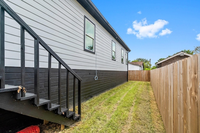 view of home's exterior featuring a lawn