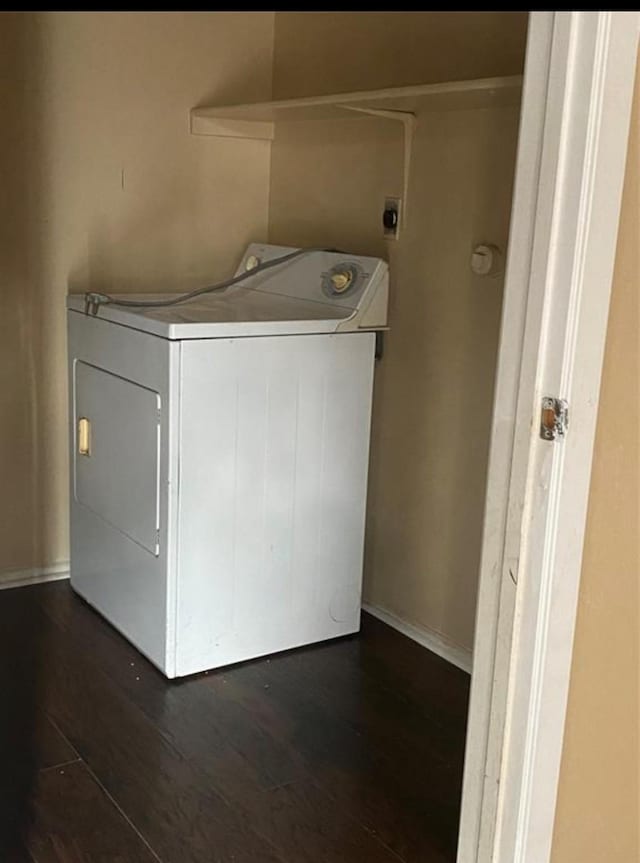 laundry room featuring dark hardwood / wood-style flooring and washer / clothes dryer