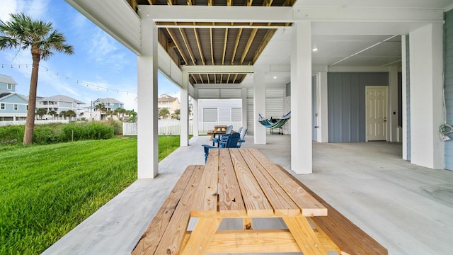 view of patio with a residential view and fence