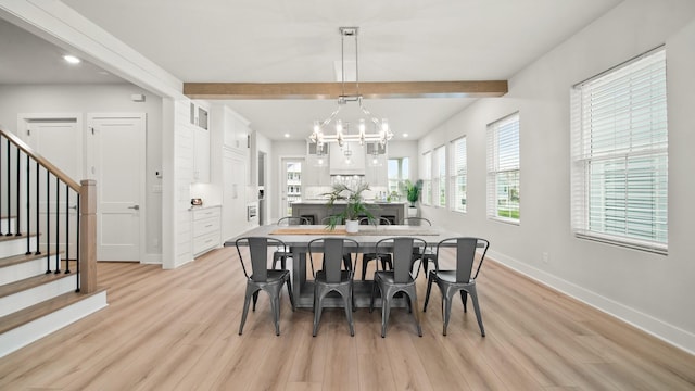 dining room with light wood finished floors, baseboards, stairway, beamed ceiling, and an inviting chandelier