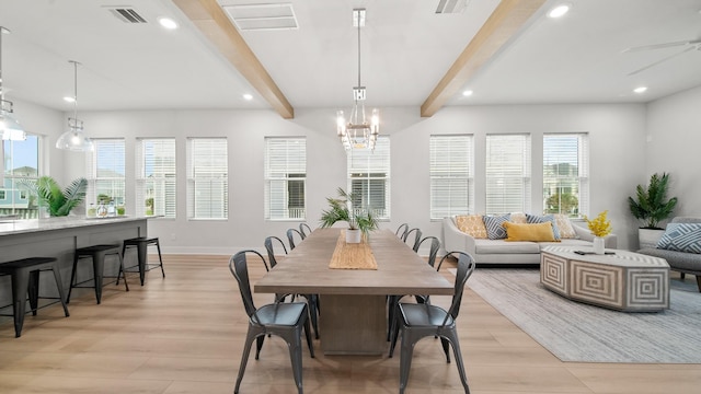 dining space featuring recessed lighting, visible vents, beam ceiling, and light wood finished floors