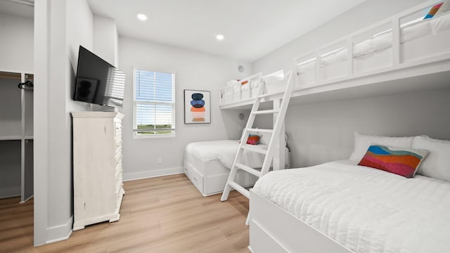 bedroom with recessed lighting, baseboards, and light wood finished floors