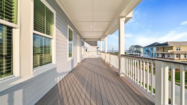 wooden terrace with a residential view