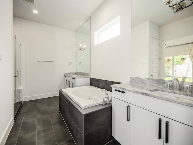 bathroom featuring vanity, tile patterned floors, and shower with separate bathtub