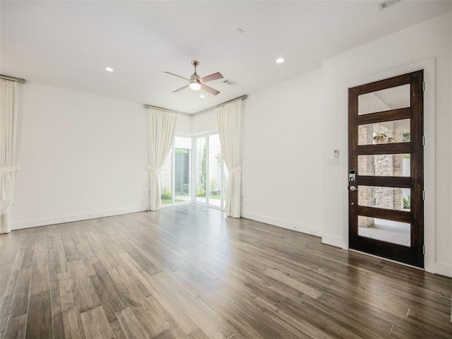 spare room with ceiling fan and dark hardwood / wood-style floors