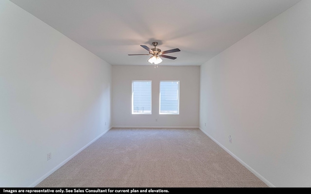 empty room featuring carpet floors and ceiling fan