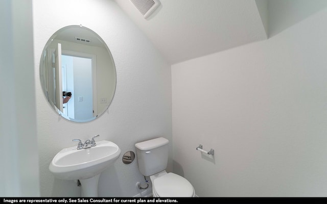 bathroom with toilet and sink