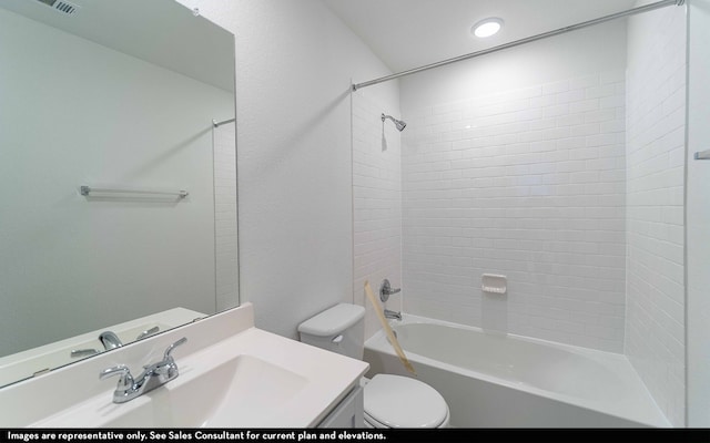 full bathroom with toilet, vanity, and tiled shower / bath