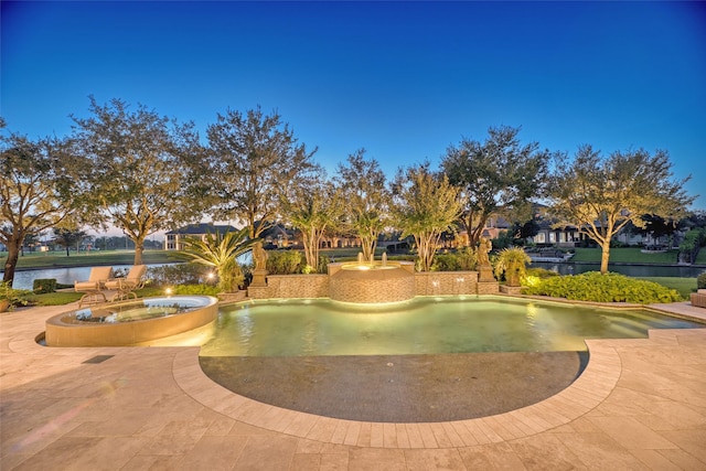 pool at dusk with a water view