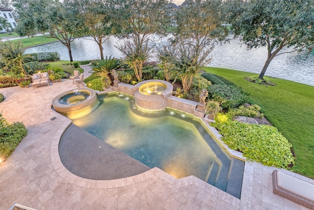 view of swimming pool with a water view, an in ground hot tub, a yard, and a patio