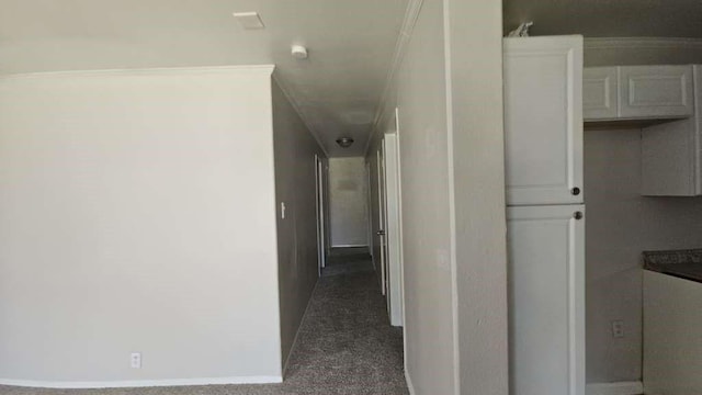 11942 Greensbrook Forest Dr, Houston, TX 77044 - hall featuring dark colored carpet, baseboards, and ornamental molding