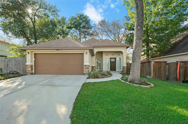 view of front facade with a garage and a front yard