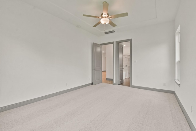 carpeted empty room with ceiling fan