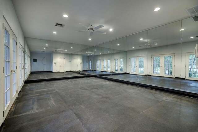 exercise room with ceiling fan and french doors