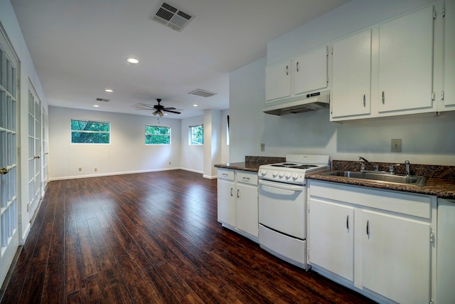 kitchen with white cabinetry, wood-type flooring, ceiling fan, white gas range, and sink