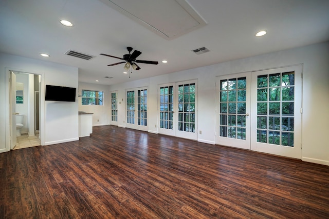 unfurnished living room featuring dark hardwood / wood-style floors, a healthy amount of sunlight, french doors, and ceiling fan