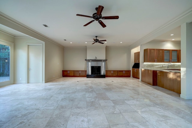 unfurnished living room with light tile patterned floors, ceiling fan, and crown molding