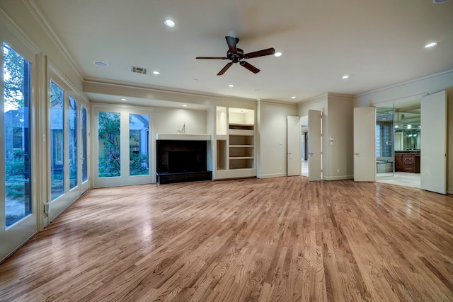 unfurnished living room with light hardwood / wood-style flooring, ornamental molding, and ceiling fan